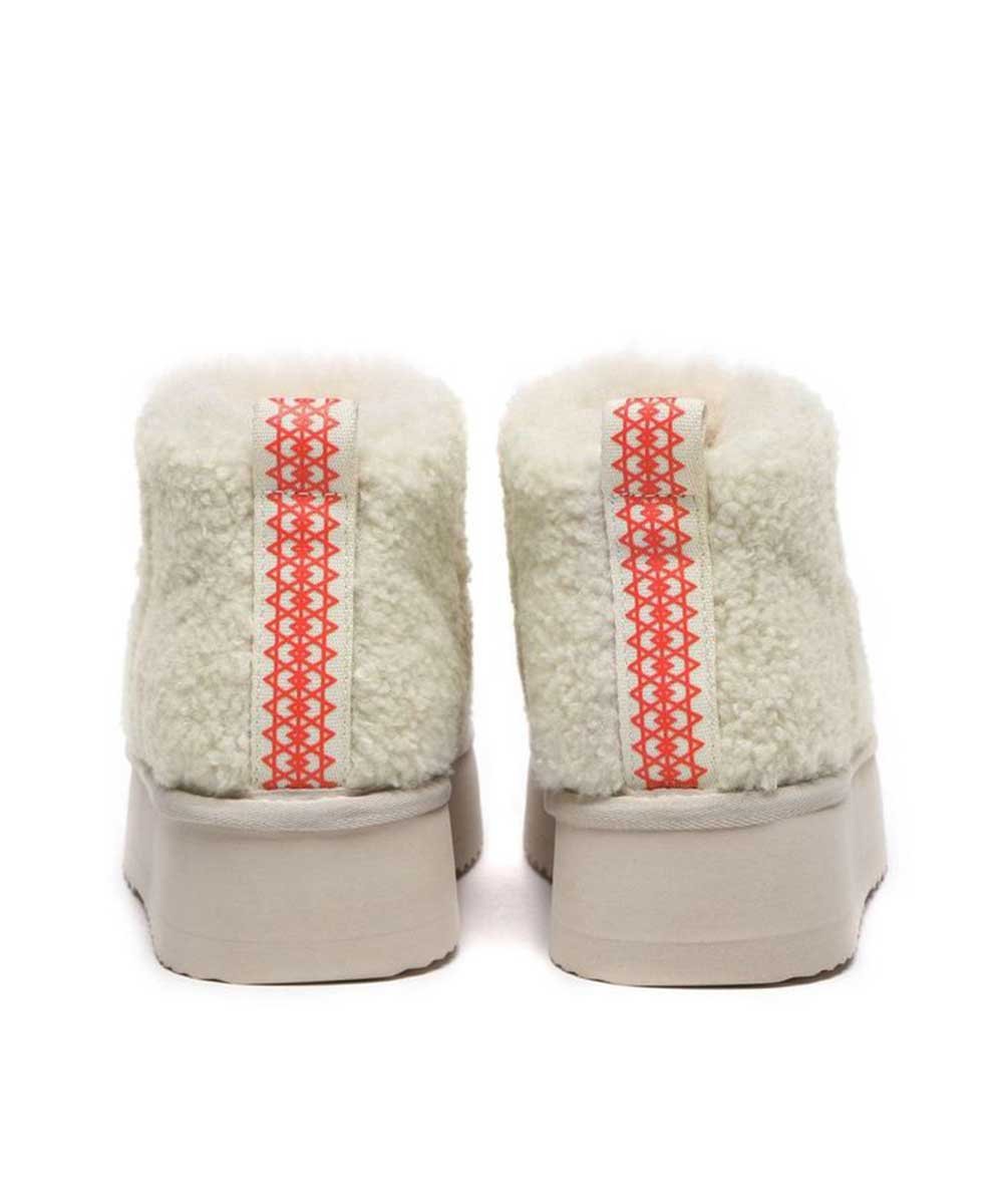 Bottes à plateforme ultra en laine bouclée pour femme