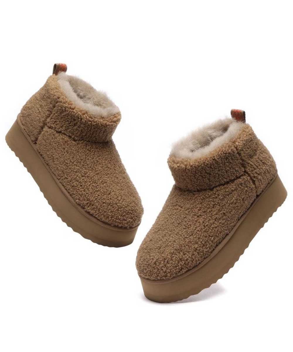 Bottes à plateforme ultra en laine bouclée pour femme